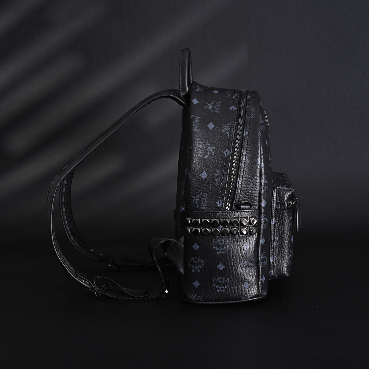 MCM Stark Visetos Medium Backpack – Black Monogram with Studded Detailing